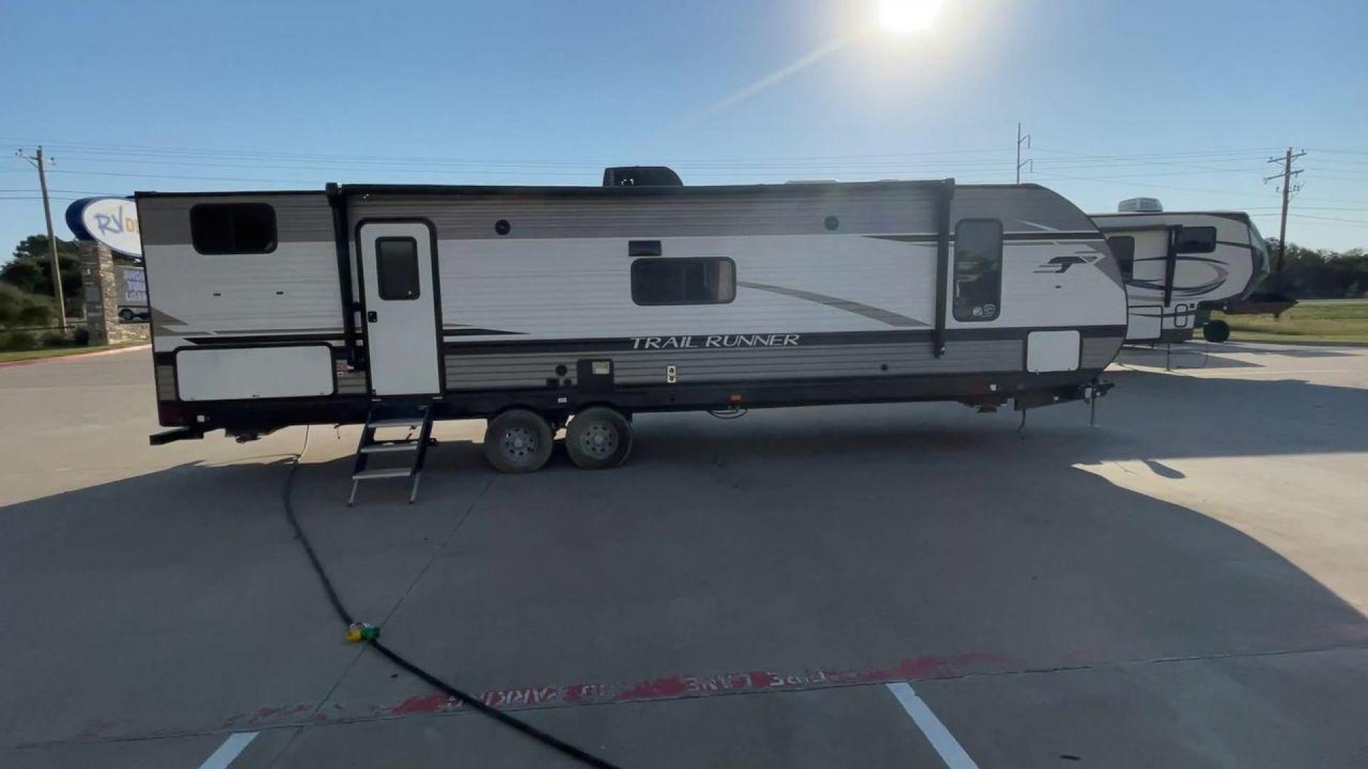 2023 HEARTLAND TRAIL RUNNER 31DB (5SFEB3722PE) , Length: 36.92 ft | Dry Weight: 7,040 lbs | GVWR: 9,642 lbs | Slides: 1 transmission, located at 4319 N Main Street, Cleburne, TX, 76033, (817) 221-0660, 32.435829, -97.384178 - The 2023 Heartland Trail Runner 31DB is a versatile and spacious travel trailer designed for families and adventure enthusiasts. This vehicle is the perfect option for families or groups looking to embark on memorable road trips. The travel trailer is a bunkhouse, and features a family-centric layou - Photo#2