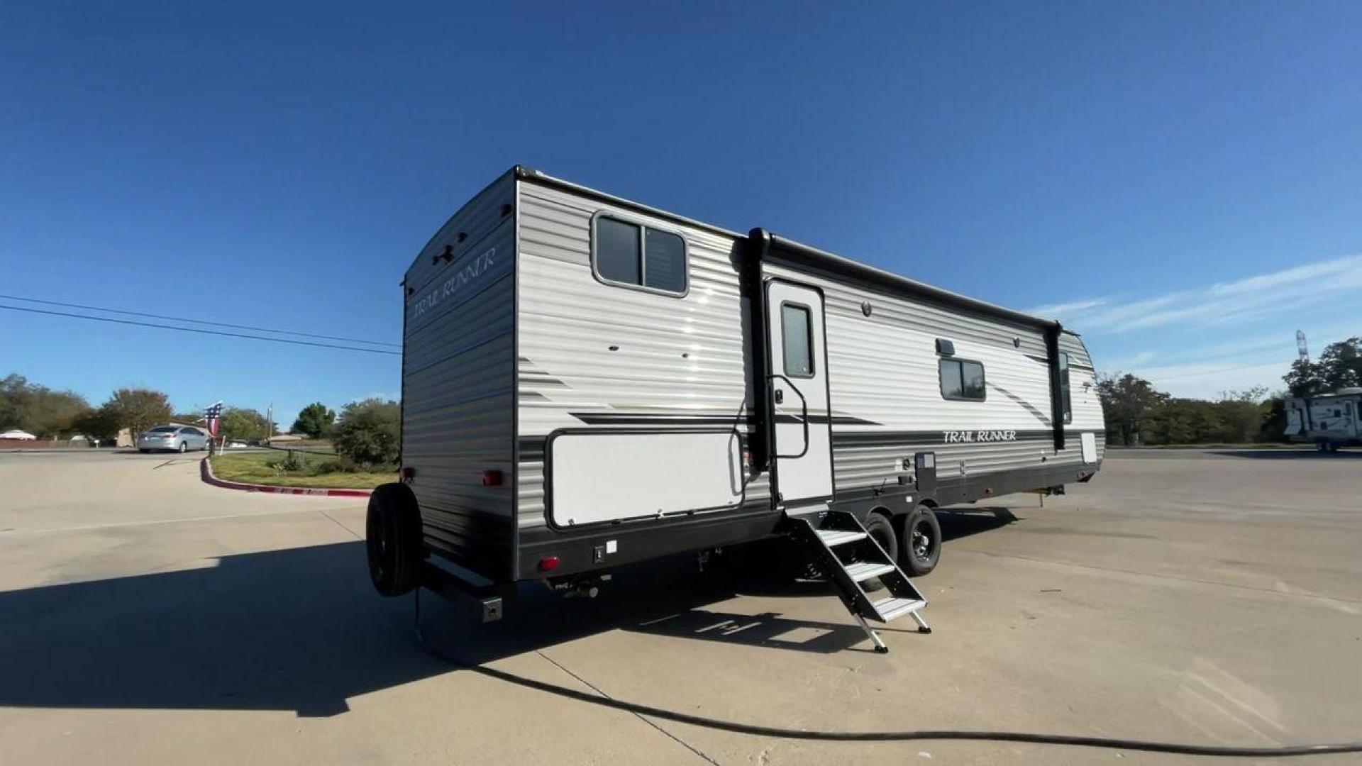 2023 HEARTLAND TRAIL RUNNER 31DB (5SFEB3729PE) , Length: 36.92 ft | Dry Weight: 7,040 lbs | GVWR: 9,642 lbs | Slides: 1 transmission, located at 4319 N Main Street, Cleburne, TX, 76033, (817) 221-0660, 32.435829, -97.384178 - The 2023 Heartland Trail Runner 31DB is a versatile and spacious travel trailer designed for families and adventure enthusiasts. This vehicle is the perfect option for families or groups looking to embark on memorable road trips. The travel trailer is a bunkhouse, and features a family-centric layou - Photo#1