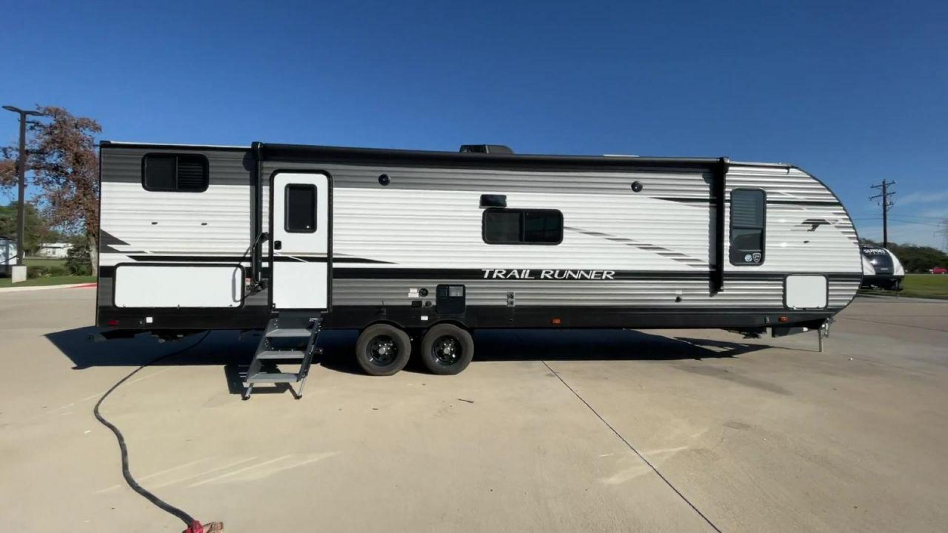 2023 HEARTLAND TRAIL RUNNER 31DB (5SFEB3729PE) , Length: 36.92 ft | Dry Weight: 7,040 lbs | GVWR: 9,642 lbs | Slides: 1 transmission, located at 4319 N Main Street, Cleburne, TX, 76033, (817) 221-0660, 32.435829, -97.384178 - The 2023 Heartland Trail Runner 31DB is a versatile and spacious travel trailer designed for families and adventure enthusiasts. This vehicle is the perfect option for families or groups looking to embark on memorable road trips. The travel trailer is a bunkhouse, and features a family-centric layou - Photo#2