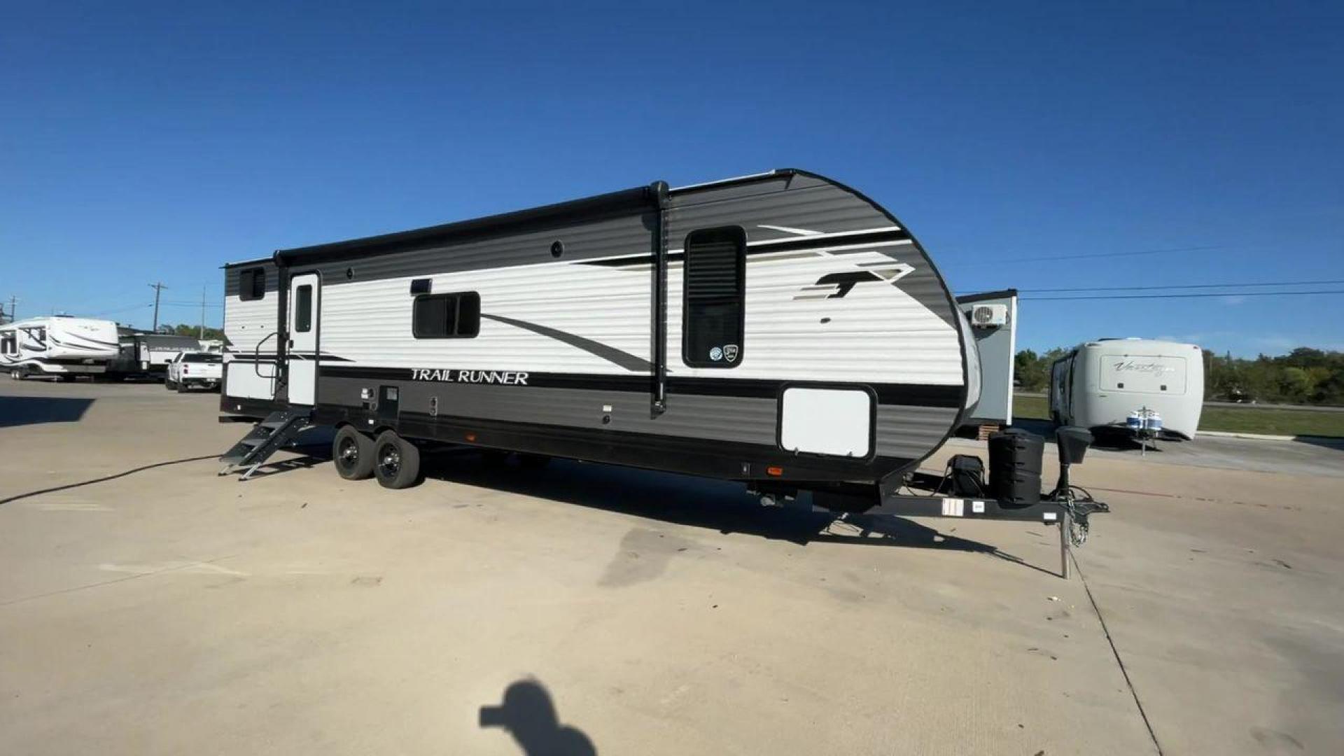 2023 HEARTLAND TRAIL RUNNER 31DB (5SFEB3729PE) , Length: 36.92 ft | Dry Weight: 7,040 lbs | GVWR: 9,642 lbs | Slides: 1 transmission, located at 4319 N Main Street, Cleburne, TX, 76033, (817) 221-0660, 32.435829, -97.384178 - The 2023 Heartland Trail Runner 31DB is a versatile and spacious travel trailer designed for families and adventure enthusiasts. This vehicle is the perfect option for families or groups looking to embark on memorable road trips. The travel trailer is a bunkhouse, and features a family-centric layou - Photo#3