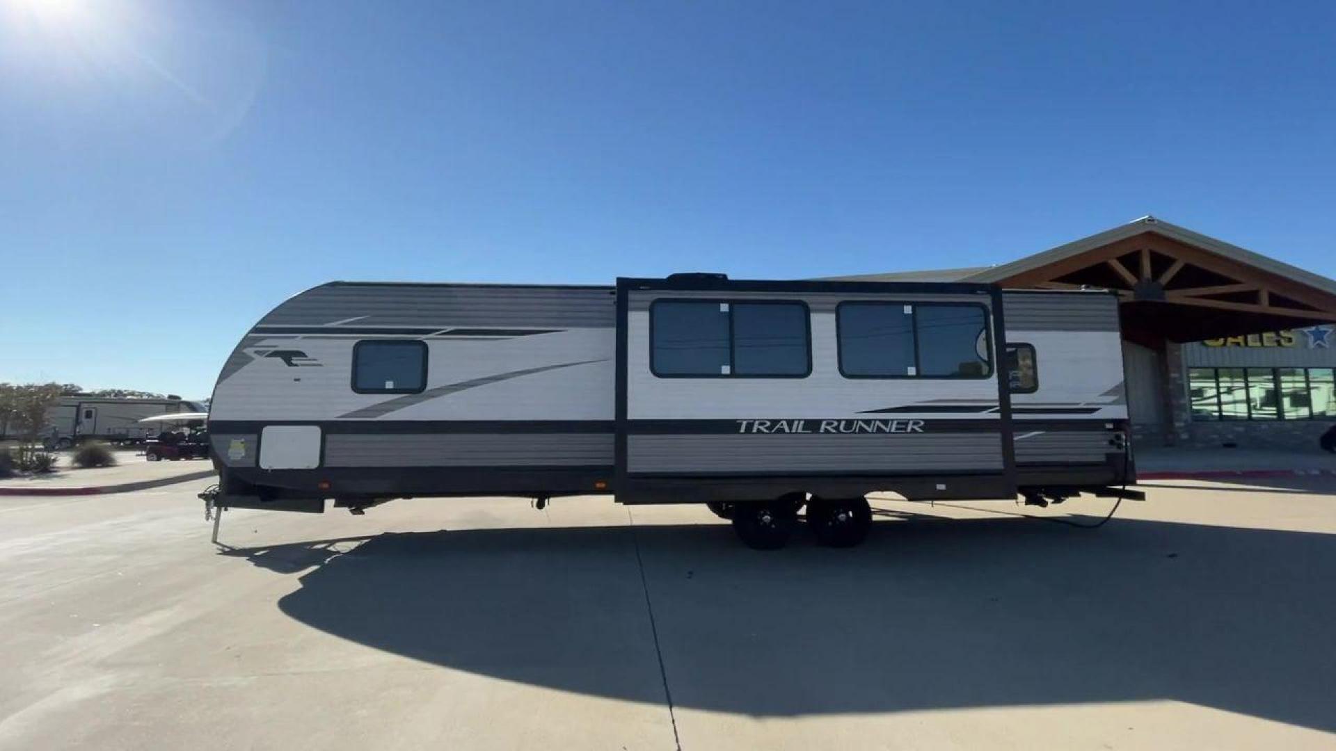 2023 HEARTLAND TRAIL RUNNER 31DB (5SFEB3729PE) , Length: 36.92 ft | Dry Weight: 7,040 lbs | GVWR: 9,642 lbs | Slides: 1 transmission, located at 4319 N Main Street, Cleburne, TX, 76033, (817) 221-0660, 32.435829, -97.384178 - The 2023 Heartland Trail Runner 31DB is a versatile and spacious travel trailer designed for families and adventure enthusiasts. This vehicle is the perfect option for families or groups looking to embark on memorable road trips. The travel trailer is a bunkhouse, and features a family-centric layou - Photo#6