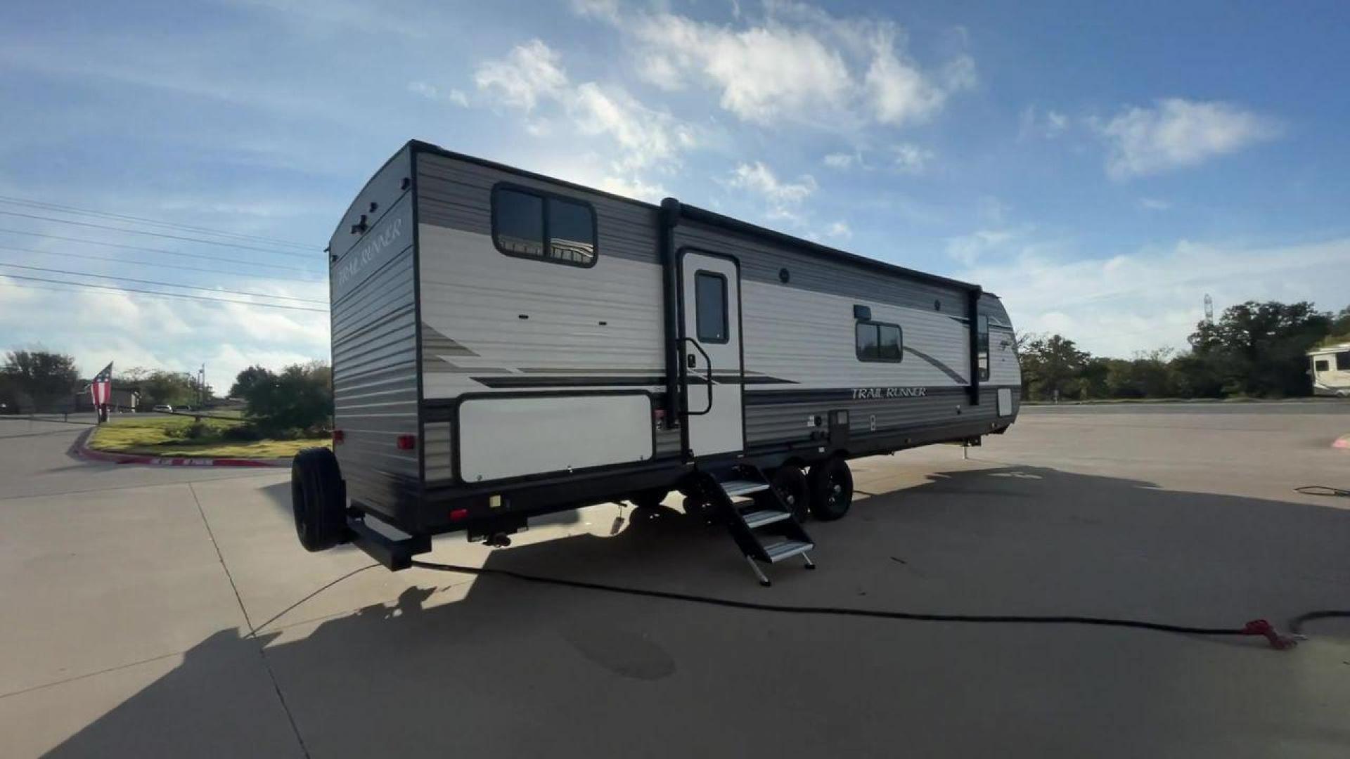 2023 HEARTLAND TRAIL RUNNER 31DB (5SFEB3726PE) , Length: 36.92 ft | Dry Weight: 7,040 lbs | GVWR: 9,642 lbs | Slides: 1 transmission, located at 4319 N Main Street, Cleburne, TX, 76033, (817) 221-0660, 32.435829, -97.384178 - The 2023 Heartland Trail Runner 31DB is a versatile and spacious travel trailer designed for families and adventure enthusiasts. This vehicle is the perfect option for families or groups looking to embark on memorable road trips. The travel trailer is a bunkhouse, and features a family-centric layou - Photo#1