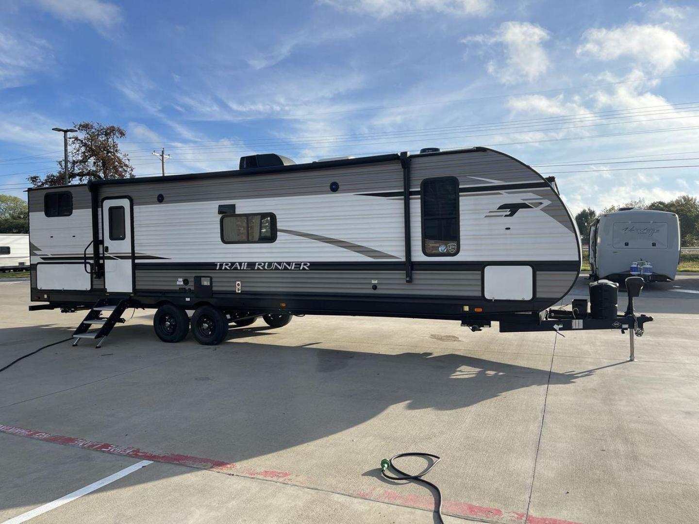 2023 HEARTLAND TRAIL RUNNER 31DB (5SFEB3726PE) , Length: 36.92 ft | Dry Weight: 7,040 lbs | GVWR: 9,642 lbs | Slides: 1 transmission, located at 4319 N Main Street, Cleburne, TX, 76033, (817) 221-0660, 32.435829, -97.384178 - The 2023 Heartland Trail Runner 31DB is a versatile and spacious travel trailer designed for families and adventure enthusiasts. This vehicle is the perfect option for families or groups looking to embark on memorable road trips. The travel trailer is a bunkhouse, and features a family-centric layou - Photo#24