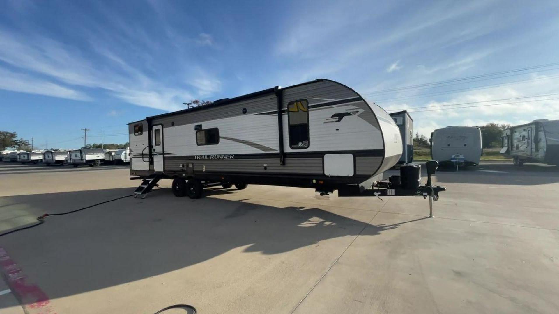 2023 HEARTLAND TRAIL RUNNER 31DB (5SFEB3726PE) , Length: 36.92 ft | Dry Weight: 7,040 lbs | GVWR: 9,642 lbs | Slides: 1 transmission, located at 4319 N Main Street, Cleburne, TX, 76033, (817) 221-0660, 32.435829, -97.384178 - The 2023 Heartland Trail Runner 31DB is a versatile and spacious travel trailer designed for families and adventure enthusiasts. This vehicle is the perfect option for families or groups looking to embark on memorable road trips. The travel trailer is a bunkhouse, and features a family-centric layou - Photo#3