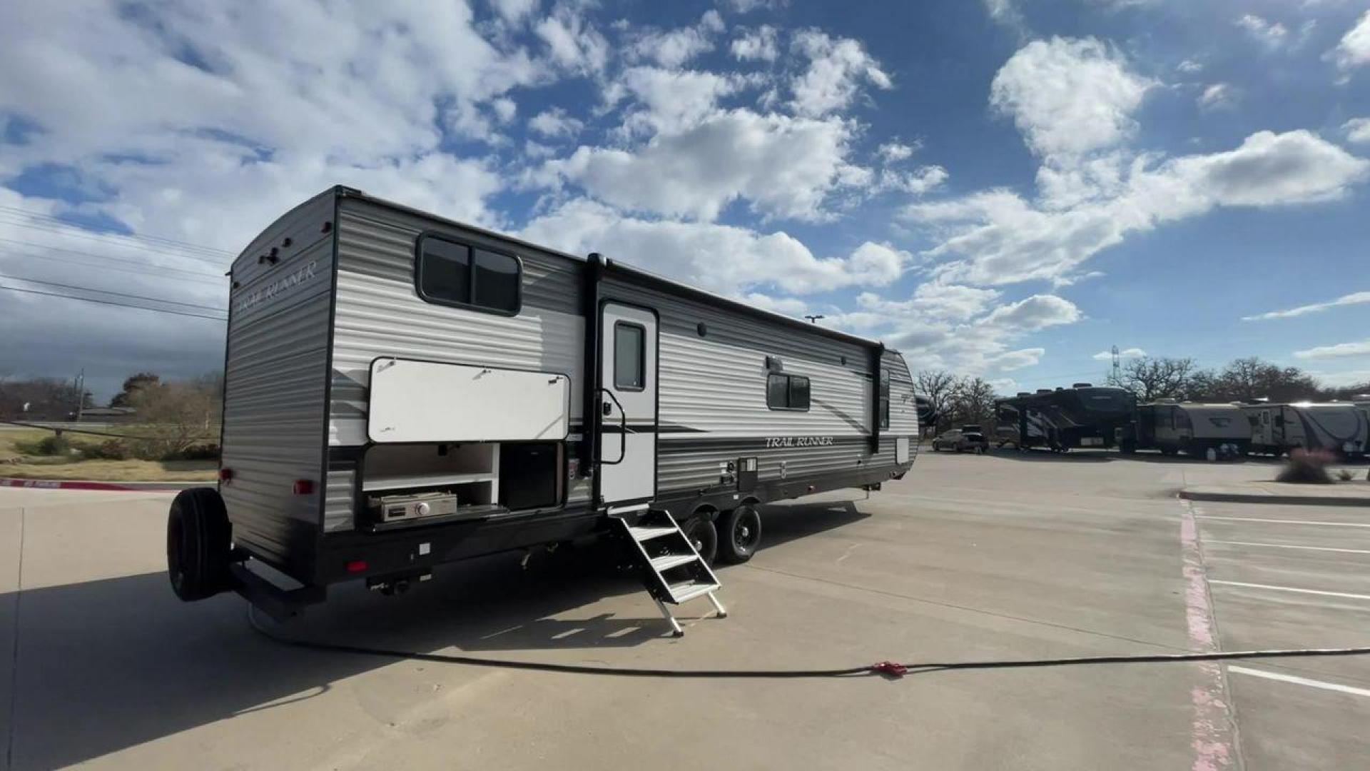 2023 HEARTLAND TRAIL RUNNER 31DB (5SFEB3722PE) , Length: 36.92 ft | Dry Weight: 7,040 lbs. | Gross Weight: 9,642 lbs | Slides: 1 transmission, located at 4319 N Main Street, Cleburne, TX, 76033, (817) 221-0660, 32.435829, -97.384178 - The 2023 Heartland Trail Runner 31DB is a family-friendly travel trailer designed to elevate your camping adventures with comfort and convenience. Measuring 36 feet, this model is a testament to Heartland's commitment to providing a spacious and well-equipped living space. The 31DB boasts a smart la - Photo#1