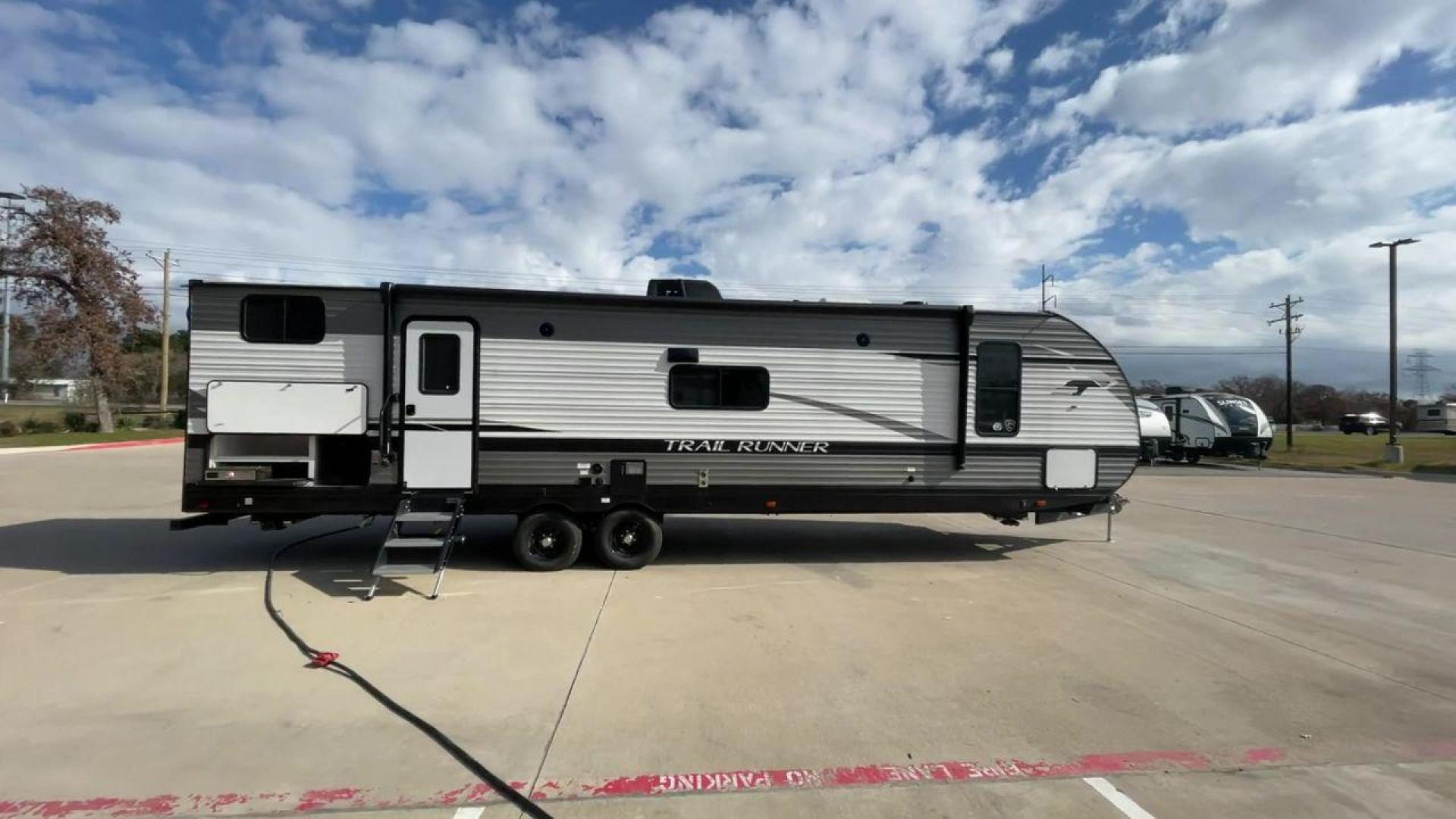 2023 HEARTLAND TRAIL RUNNER 31DB (5SFEB3722PE) , Length: 36.92 ft | Dry Weight: 7,040 lbs. | Gross Weight: 9,642 lbs | Slides: 1 transmission, located at 4319 N Main Street, Cleburne, TX, 76033, (817) 221-0660, 32.435829, -97.384178 - The 2023 Heartland Trail Runner 31DB is a family-friendly travel trailer designed to elevate your camping adventures with comfort and convenience. Measuring 36 feet, this model is a testament to Heartland's commitment to providing a spacious and well-equipped living space. The 31DB boasts a smart la - Photo#2