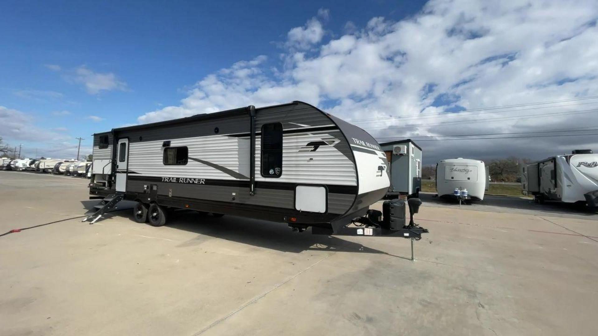 2023 HEARTLAND TRAIL RUNNER 31DB (5SFEB3722PE) , Length: 36.92 ft | Dry Weight: 7,040 lbs. | Gross Weight: 9,642 lbs | Slides: 1 transmission, located at 4319 N Main Street, Cleburne, TX, 76033, (817) 221-0660, 32.435829, -97.384178 - The 2023 Heartland Trail Runner 31DB is a family-friendly travel trailer designed to elevate your camping adventures with comfort and convenience. Measuring 36 feet, this model is a testament to Heartland's commitment to providing a spacious and well-equipped living space. The 31DB boasts a smart la - Photo#3