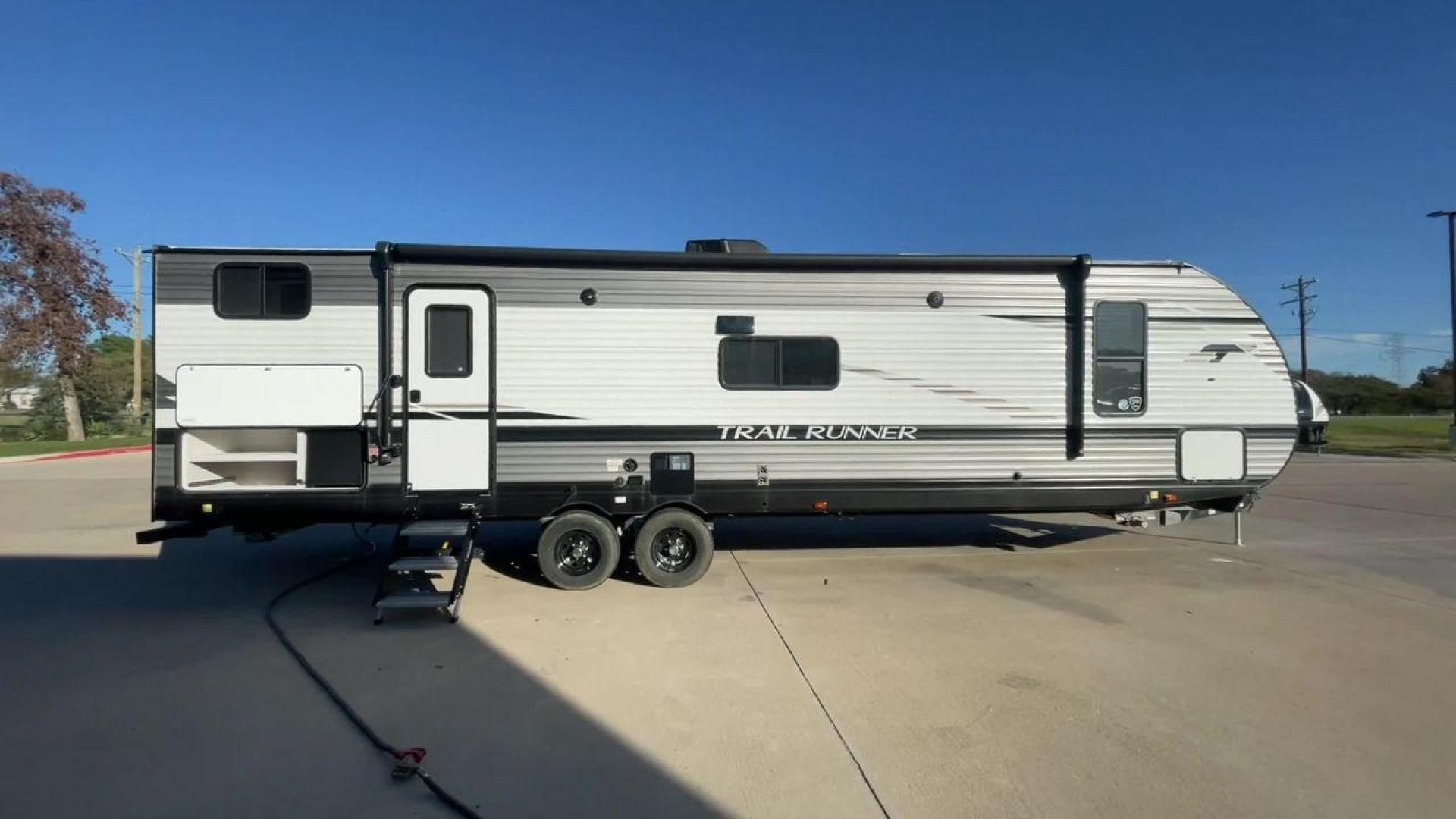 2023 HEARTLAND TRAIL RUNNER 31DB (5SFEB3723PE) , Length: 36.92 ft | Dry Weight: 7,040 lbs | GVWR: 9,642 lbs | Slides: 1 transmission, located at 4319 N Main Street, Cleburne, TX, 76033, (817) 221-0660, 32.435829, -97.384178 - The 2023 Heartland Trail Runner 31DB is a versatile and spacious travel trailer designed for families and adventure enthusiasts. This vehicle is the perfect option for families or groups looking to embark on memorable road trips. The travel trailer is a bunkhouse, and features a family-centric layou - Photo#2