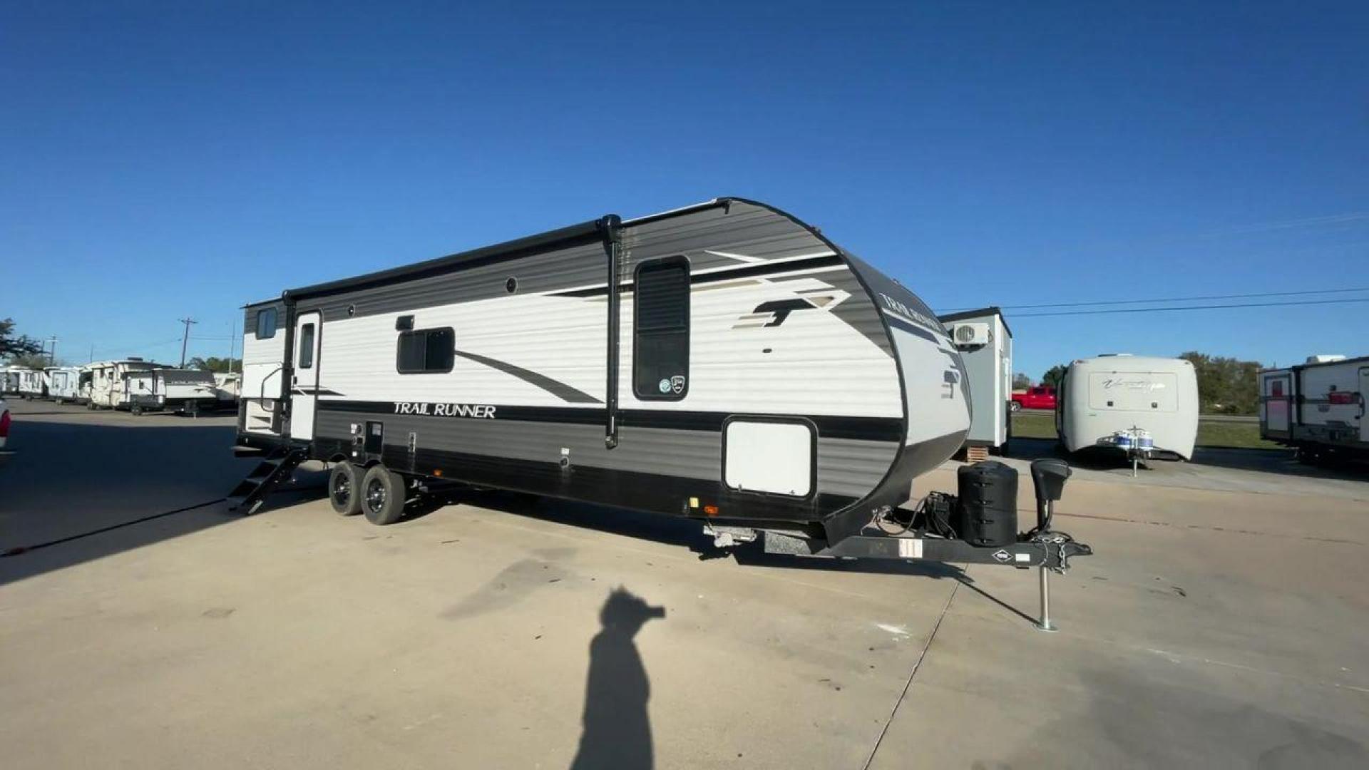 2023 HEARTLAND TRAIL RUNNER 31DB (5SFEB3723PE) , Length: 36.92 ft | Dry Weight: 7,040 lbs | GVWR: 9,642 lbs | Slides: 1 transmission, located at 4319 N Main Street, Cleburne, TX, 76033, (817) 221-0660, 32.435829, -97.384178 - The 2023 Heartland Trail Runner 31DB is a versatile and spacious travel trailer designed for families and adventure enthusiasts. This vehicle is the perfect option for families or groups looking to embark on memorable road trips. The travel trailer is a bunkhouse, and features a family-centric layou - Photo#3