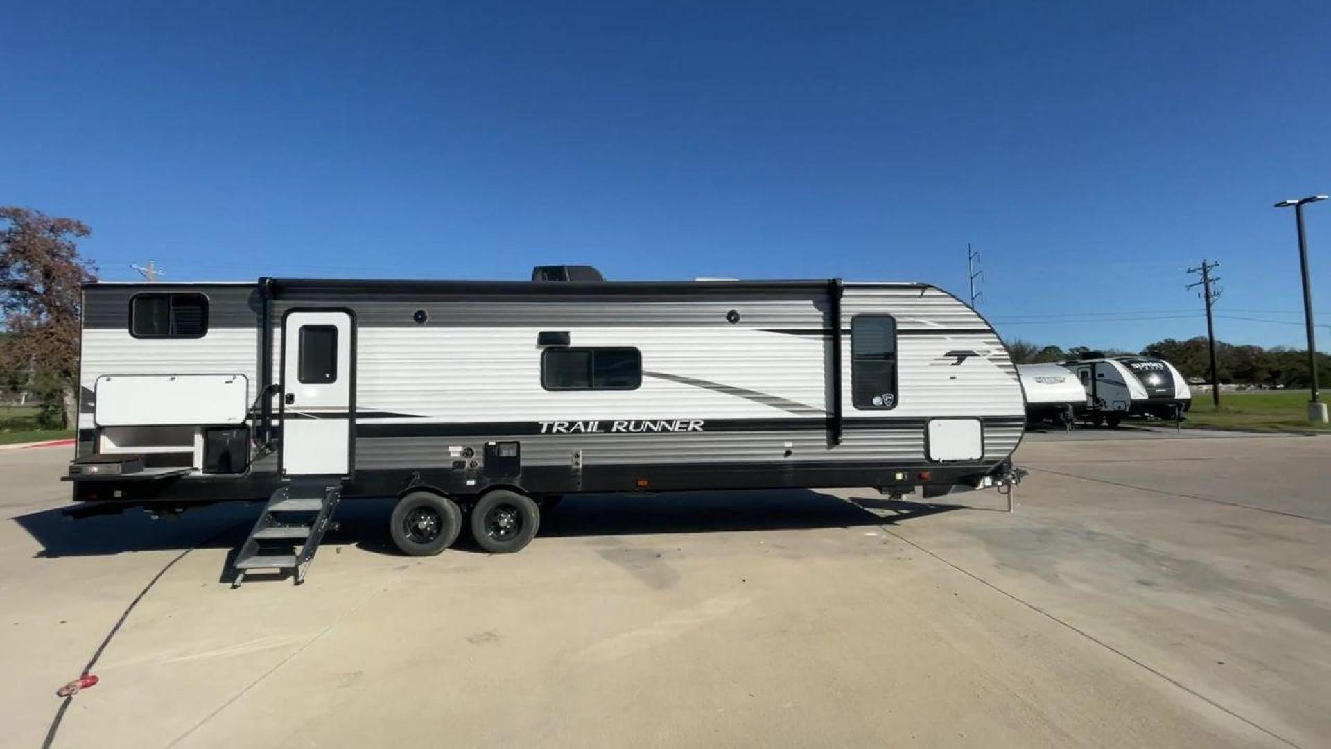 2023 HEARTLAND TRAIL RUNNER 31DB (5SFEB3720PE) , Length: 36.92 ft. | Dry Weight: 7,040 lbs. | Gross Weight: 9,642 lbs. | Slides: 1 transmission, located at 4319 N Main Street, Cleburne, TX, 76033, (817) 221-0660, 32.435829, -97.384178 - The 2023 Heartland Trail Runner 31DB is a versatile and spacious travel trailer designed for families and adventure enthusiasts. This vehicle is the perfect option for families or groups looking to embark on memorable road trips. The travel trailer is a bunkhouse, and features a family-centric layou - Photo#2