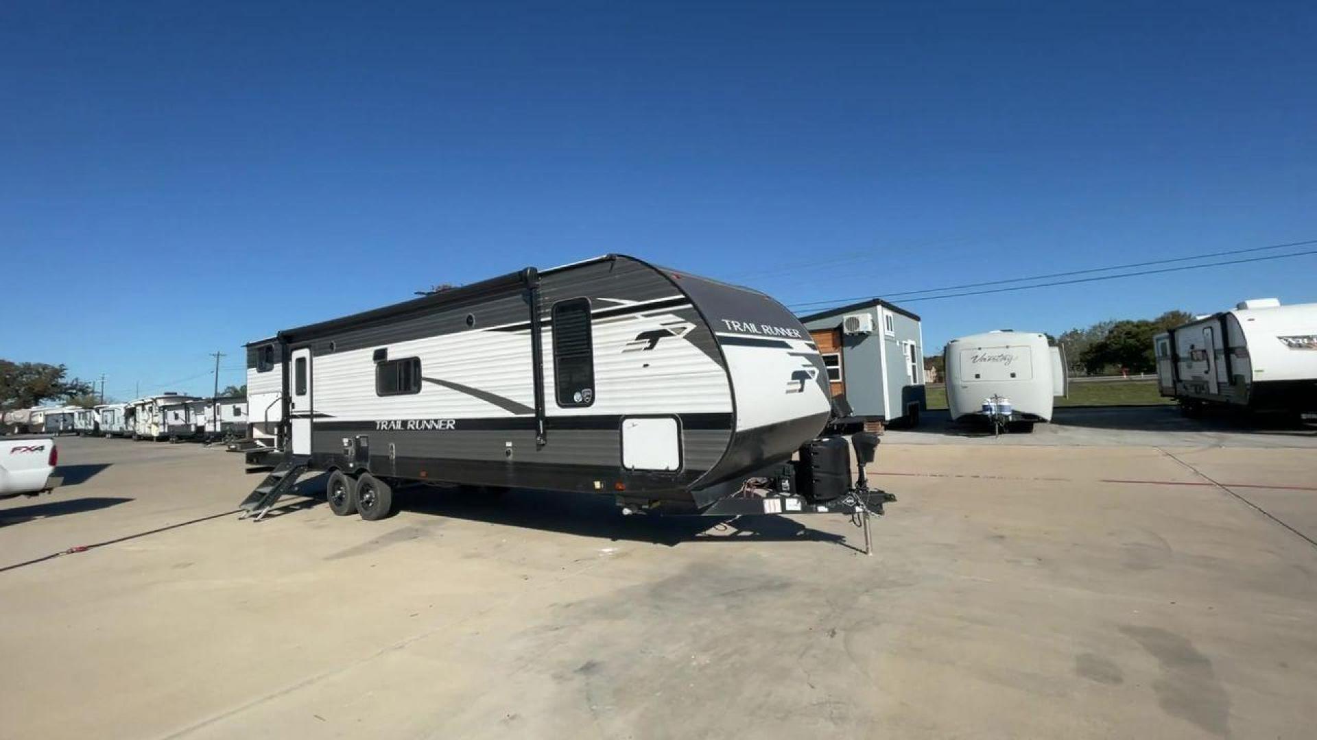 2023 HEARTLAND TRAIL RUNNER 31DB (5SFEB3720PE) , Length: 36.92 ft. | Dry Weight: 7,040 lbs. | Gross Weight: 9,642 lbs. | Slides: 1 transmission, located at 4319 N Main Street, Cleburne, TX, 76033, (817) 221-0660, 32.435829, -97.384178 - The 2023 Heartland Trail Runner 31DB is a versatile and spacious travel trailer designed for families and adventure enthusiasts. This vehicle is the perfect option for families or groups looking to embark on memorable road trips. The travel trailer is a bunkhouse, and features a family-centric layou - Photo#3