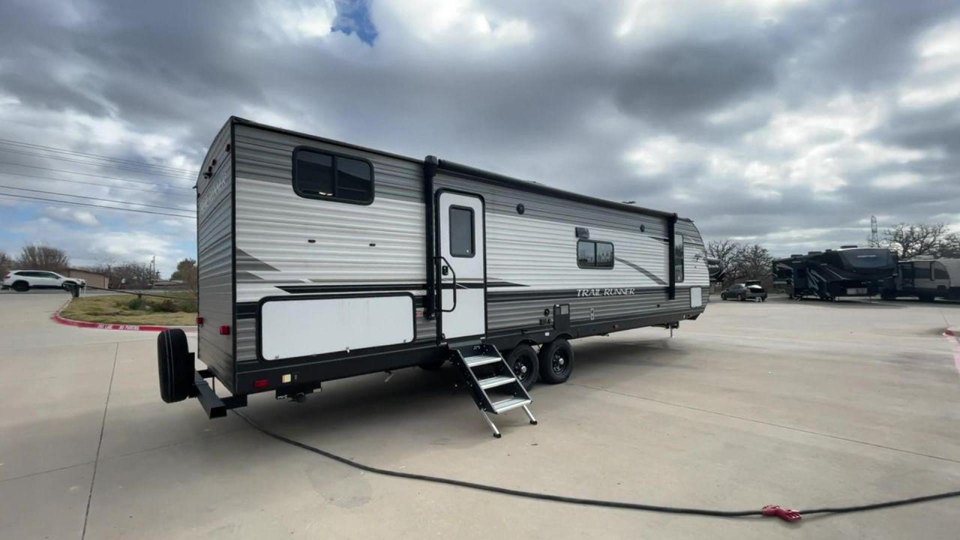 2023 HEARTLAND TRAIL RUNNER 31DB (5SFEB3729PE) , Length: 36.92 ft | Dry Weight: 7,040 lbs. | Gross Weight: 9,642 lbs | Slides: 1 transmission, located at 4319 N Main Street, Cleburne, TX, 76033, (817) 221-0660, 32.435829, -97.384178 - The 2023 Heartland Trail Runner 31DB is a family-friendly travel trailer designed to elevate your camping adventures with comfort and convenience. Measuring 36 feet, this model is a testament to Heartland's commitment to providing a spacious and well-equipped living space. The 31DB boasts a smart la - Photo#1