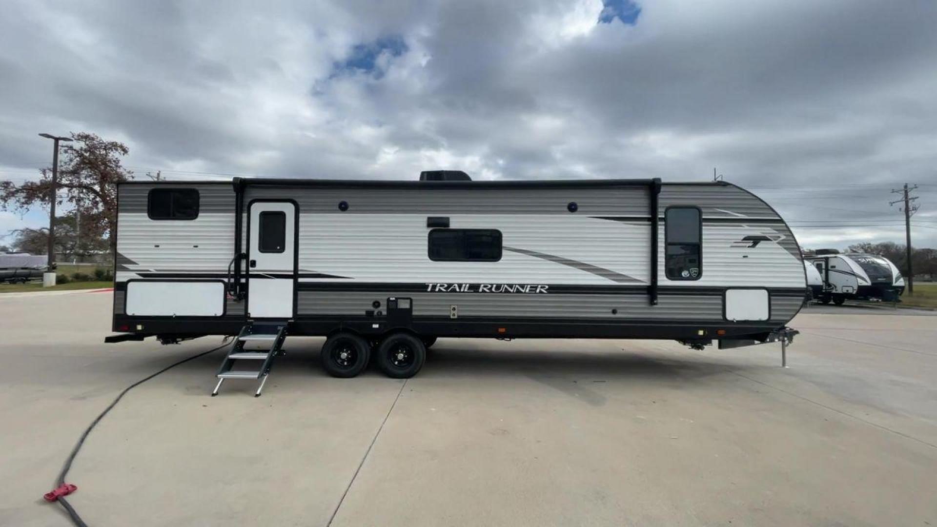 2023 HEARTLAND TRAIL RUNNER 31DB (5SFEB3729PE) , Length: 36.92 ft | Dry Weight: 7,040 lbs. | Gross Weight: 9,642 lbs | Slides: 1 transmission, located at 4319 N Main Street, Cleburne, TX, 76033, (817) 221-0660, 32.435829, -97.384178 - The 2023 Heartland Trail Runner 31DB is a family-friendly travel trailer designed to elevate your camping adventures with comfort and convenience. Measuring 36 feet, this model is a testament to Heartland's commitment to providing a spacious and well-equipped living space. The 31DB boasts a smart la - Photo#2