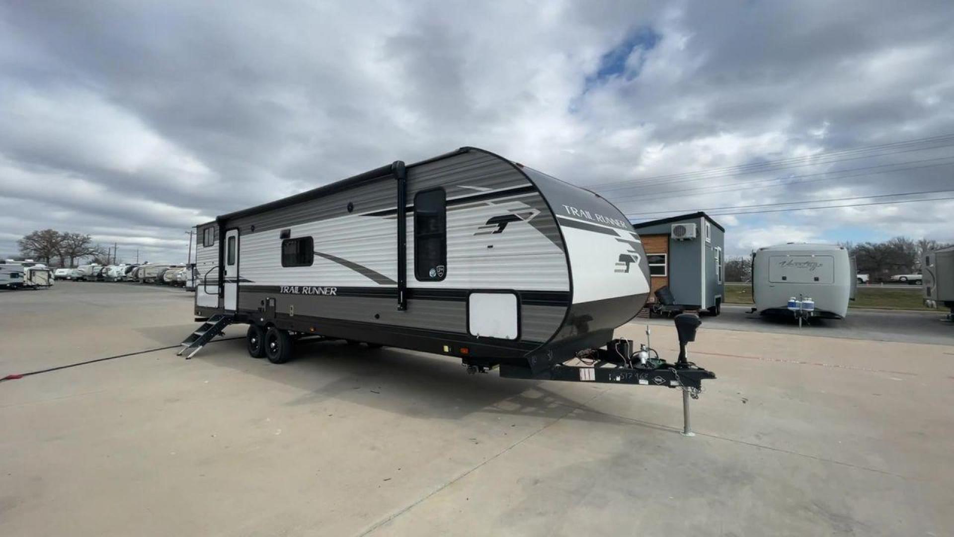 2023 HEARTLAND TRAIL RUNNER 31DB (5SFEB3729PE) , Length: 36.92 ft | Dry Weight: 7,040 lbs. | Gross Weight: 9,642 lbs | Slides: 1 transmission, located at 4319 N Main Street, Cleburne, TX, 76033, (817) 221-0660, 32.435829, -97.384178 - The 2023 Heartland Trail Runner 31DB is a family-friendly travel trailer designed to elevate your camping adventures with comfort and convenience. Measuring 36 feet, this model is a testament to Heartland's commitment to providing a spacious and well-equipped living space. The 31DB boasts a smart la - Photo#3