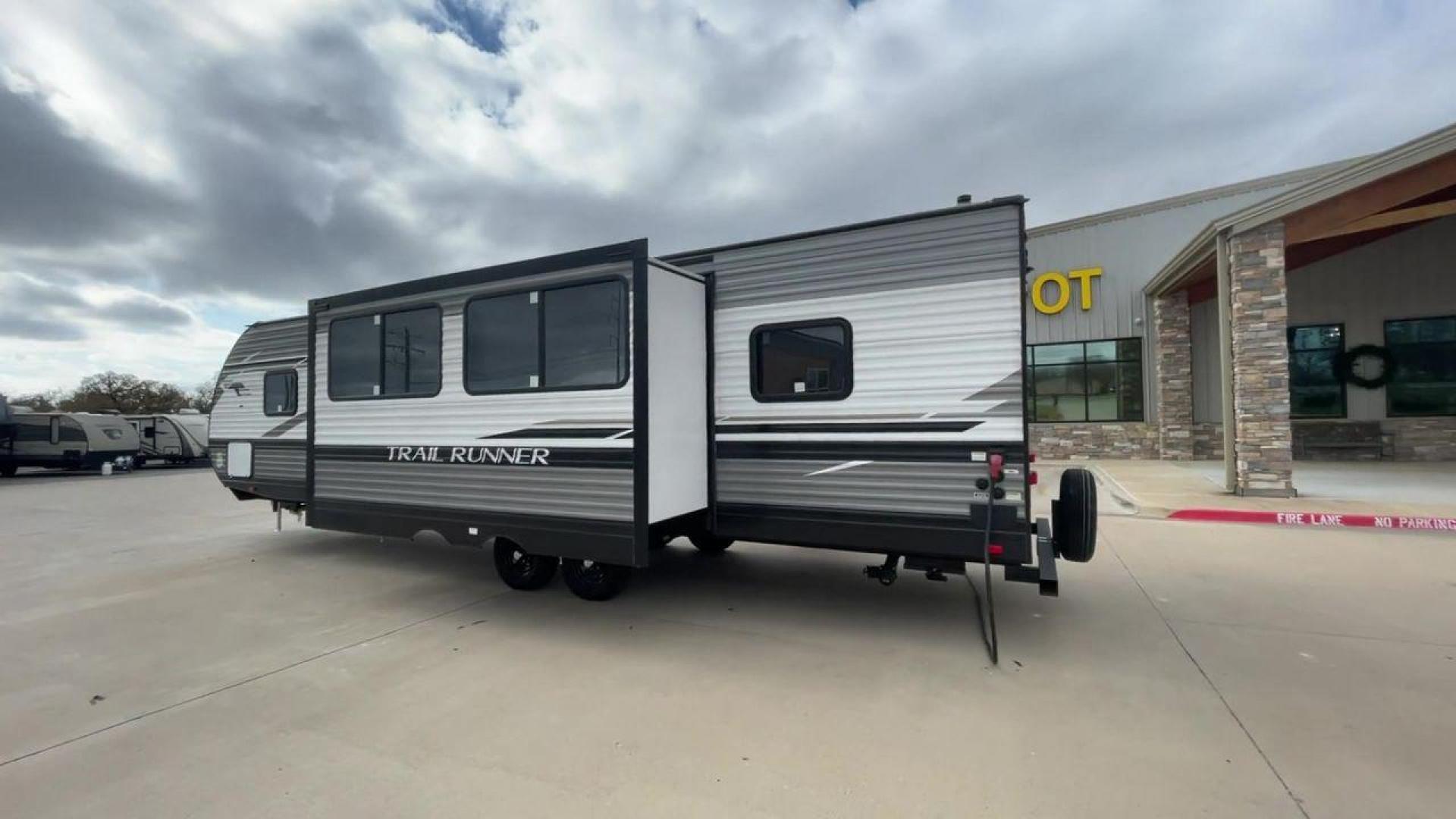 2023 HEARTLAND TRAIL RUNNER 31DB (5SFEB3729PE) , Length: 36.92 ft | Dry Weight: 7,040 lbs. | Gross Weight: 9,642 lbs | Slides: 1 transmission, located at 4319 N Main Street, Cleburne, TX, 76033, (817) 221-0660, 32.435829, -97.384178 - The 2023 Heartland Trail Runner 31DB is a family-friendly travel trailer designed to elevate your camping adventures with comfort and convenience. Measuring 36 feet, this model is a testament to Heartland's commitment to providing a spacious and well-equipped living space. The 31DB boasts a smart la - Photo#7