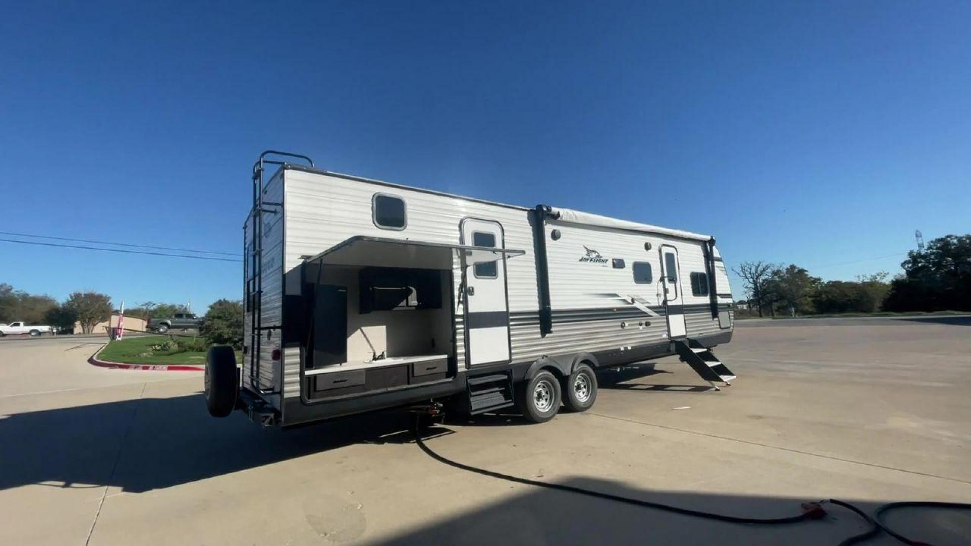 2023 JAYCO JAYFLIGHT 324BDS (1UJBC0BT8P1) , Length: 36.33 ft.| Dry Weight: 7,665 lbs. | Gross Weight: 9,000 lbs.| Slides: 2 transmission, located at 4319 N Main Street, Cleburne, TX, 76033, (817) 221-0660, 32.435829, -97.384178 - The 2023 Jay Flight 324BDS isn't just a travel trailer; it's your adventure-ready home on wheels. Meticulously crafted by Jayco, renowned for their dedication to quality and innovation, this rig caters to families and explorers alike, offering spacious comfort and thoughtful features for an unforget - Photo#1