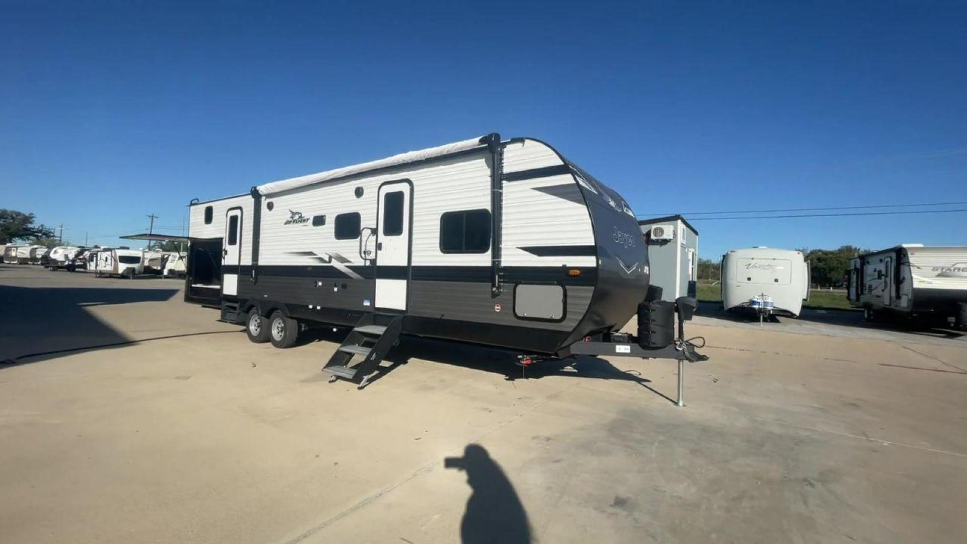 2023 JAYCO JAYFLIGHT 324BDS (1UJBC0BT8P1) , Length: 36.33 ft.| Dry Weight: 7,665 lbs. | Gross Weight: 9,000 lbs.| Slides: 2 transmission, located at 4319 N Main Street, Cleburne, TX, 76033, (817) 221-0660, 32.435829, -97.384178 - The 2023 Jay Flight 324BDS isn't just a travel trailer; it's your adventure-ready home on wheels. Meticulously crafted by Jayco, renowned for their dedication to quality and innovation, this rig caters to families and explorers alike, offering spacious comfort and thoughtful features for an unforget - Photo#3