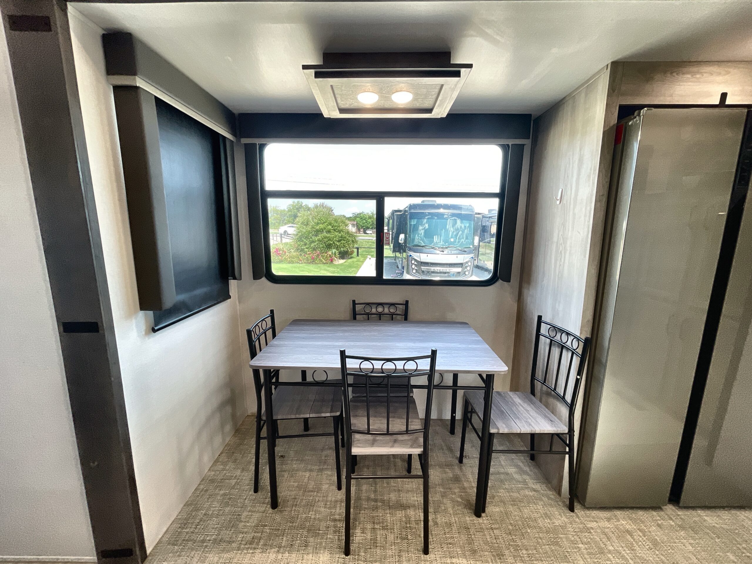 RV Depot - 2024 KEYSTONE MONTANA 377FL four seat free standing table scaled Four seat free standing table and chairs in a Keystone Montana fifth wheel